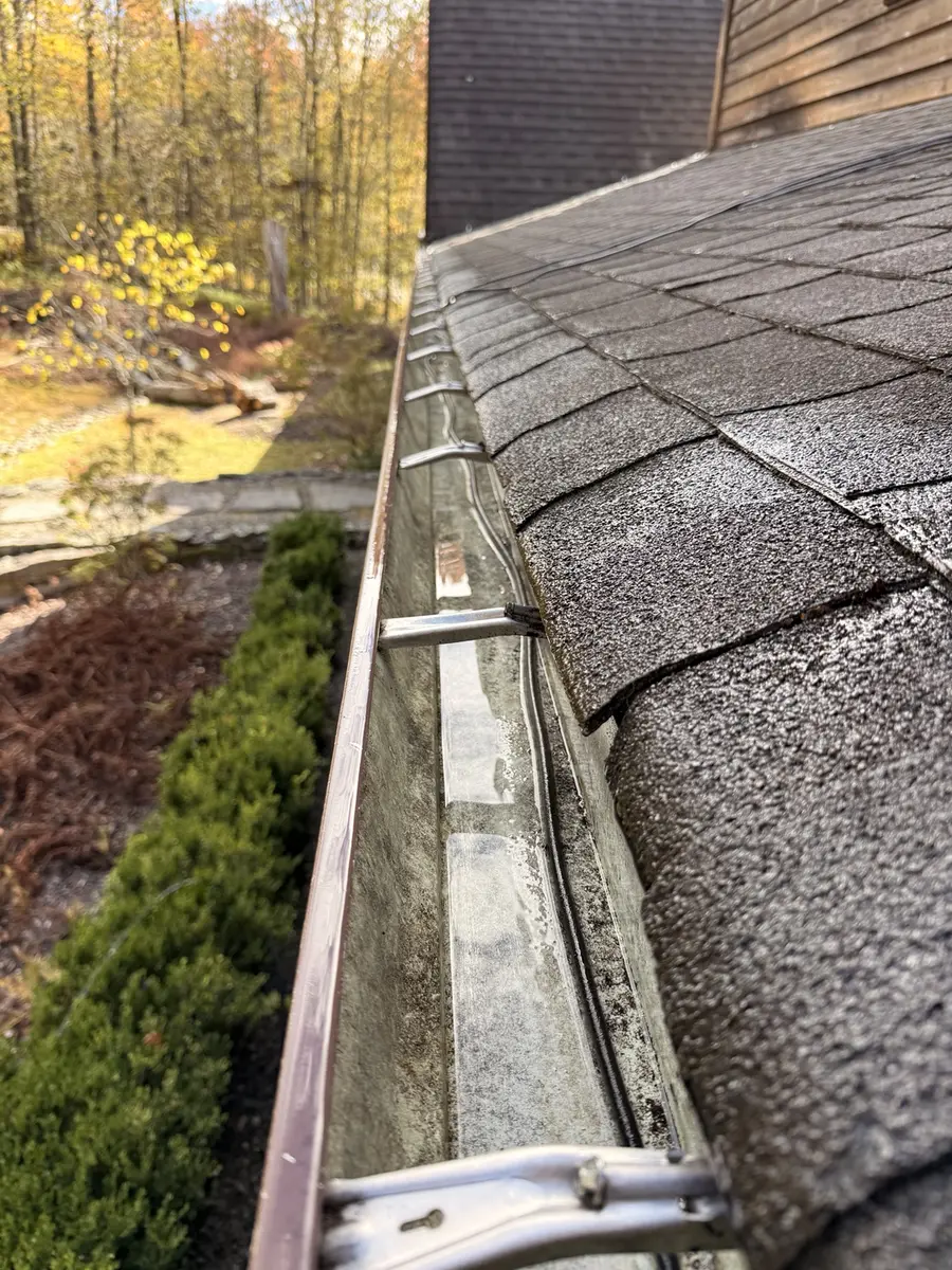 Clean and open gutter after AidPro gutter cleaning