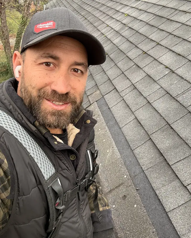 Manny Jimenez, owner of AidPro Home Care Services, on a roof in Bergen County, New Jersey