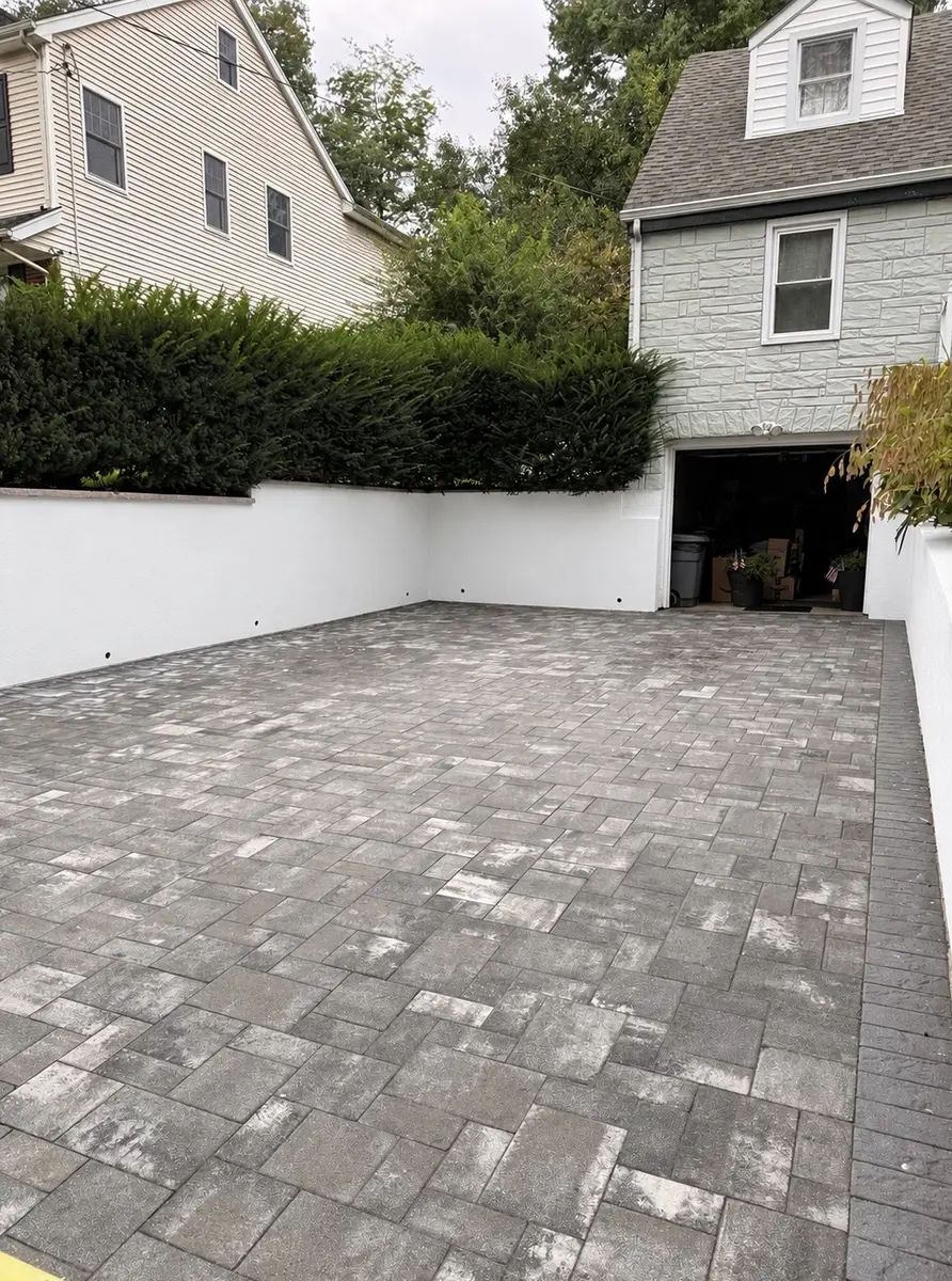 Clean and restored paver driveway after AidPro cleaning and sealing